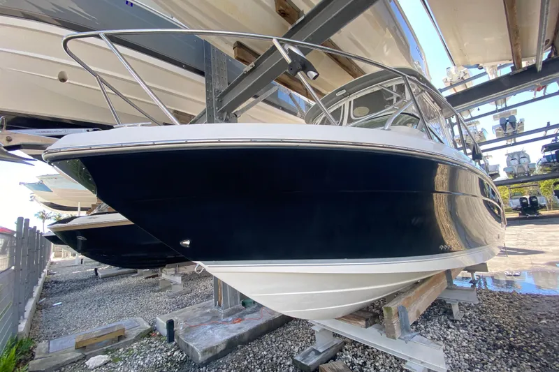 Slide: The Image of 2007 Robalo R265 Walkaround boat on dry dock, side view. - 5
