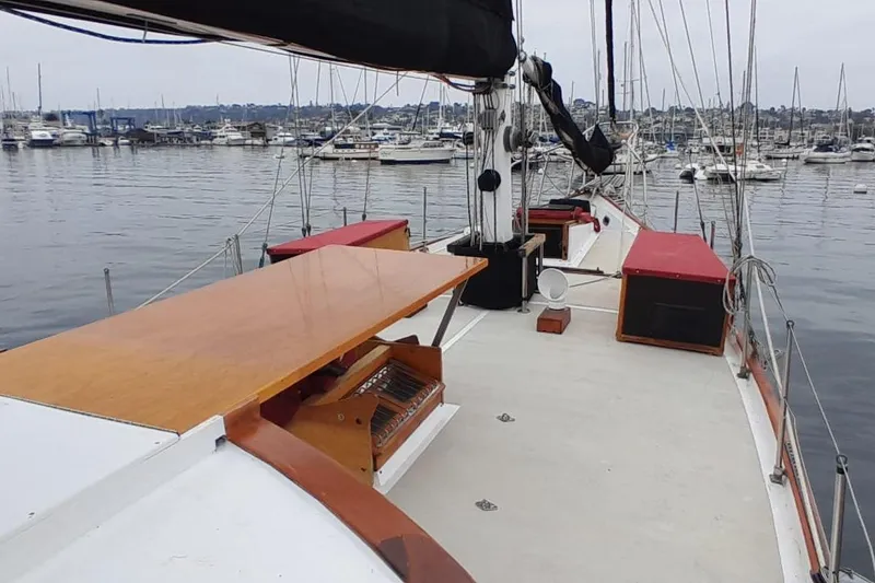 Slide: The Image of Sailboat deck view of 1974 Force Hudson 50, moored in a marina. - 15