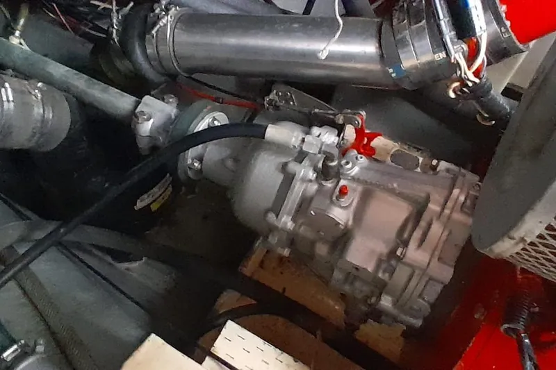 Slide: The Image of 1974 Force Hudson 50 engine compartment with visible mechanical components and wiring. - 25