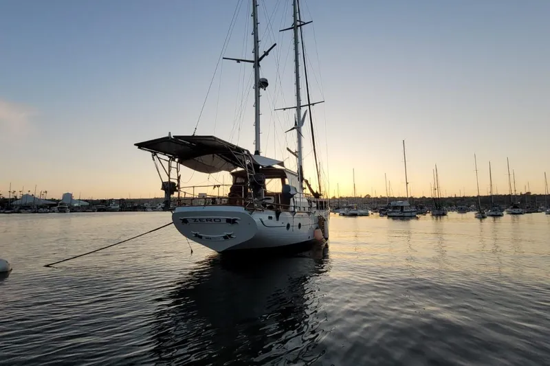 Slide: The Image of Sailboat "Zero" at sunset, 1974 Force Hudson 50, anchored in a serene harbor. - 30