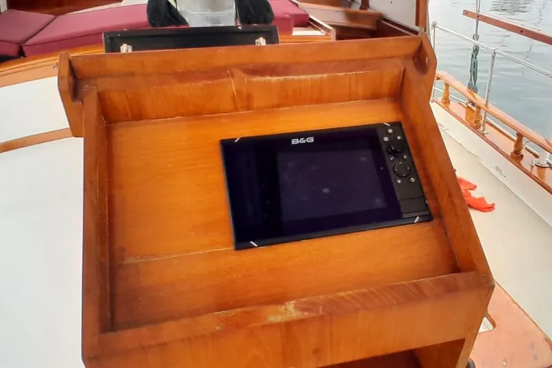 Slide: The Image of Wooden dashboard with B&G navigation device on 1974 Force Hudson 50 boat. - 31