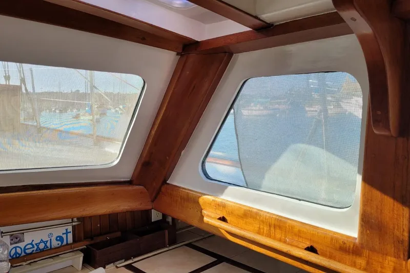 Slide: The Image of Interior view of 1974 Force Hudson 50 boat with wooden trim and window. - 34