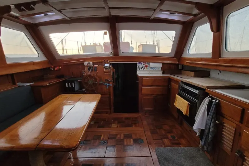 Slide: The Image of Interior of a 1974 Force Hudson 50 sailboat with wooden furnishings and nautical decor. - 40