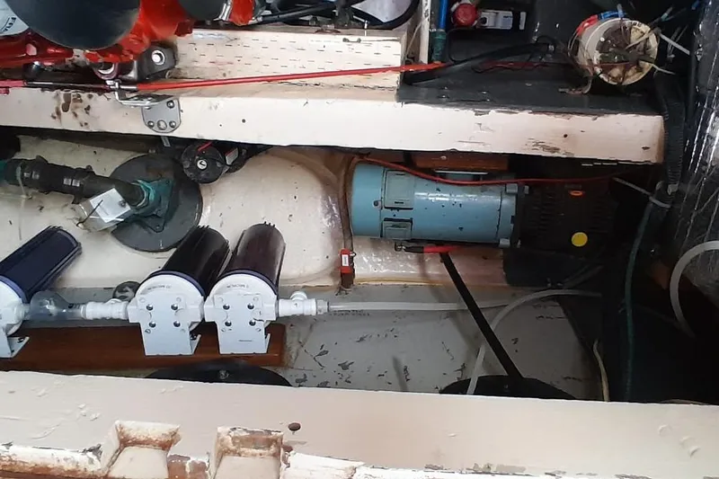 Slide: The Image of 1974 Force Hudson 50 engine compartment with filters and wiring. - 43