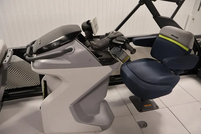 Slide: The Image of 2025 Sea-Doo Switch Cruise 21 cockpit with modern steering and comfortable seating. - 13