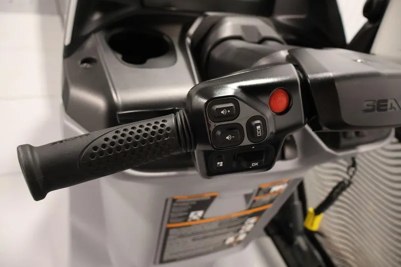 Slide: The Image of Close-up of 2025 Sea-Doo Switch Cruise 21 handlebar controls and buttons. - 20