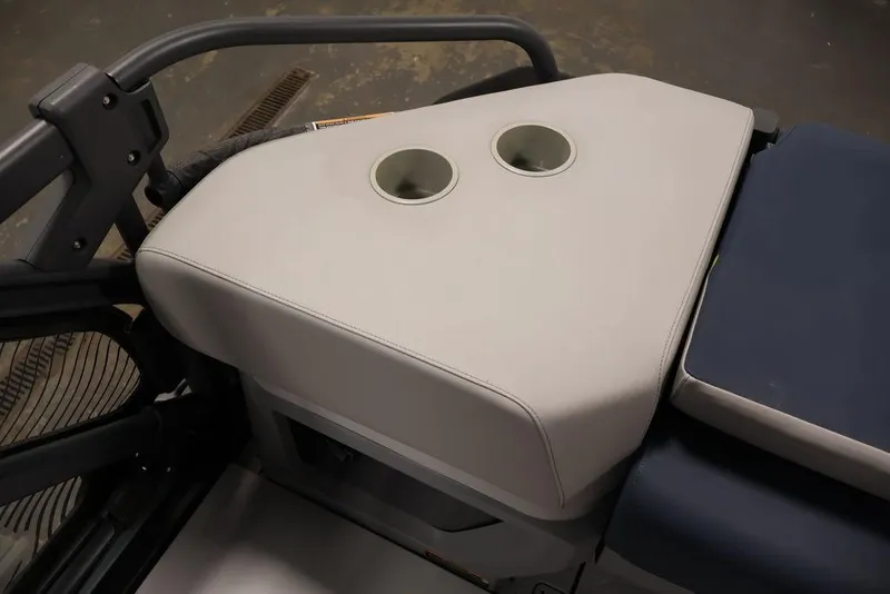 Slide: The Image of 2025 Sea-Doo Switch Cruise 21 interior with dual cup holders. - 26