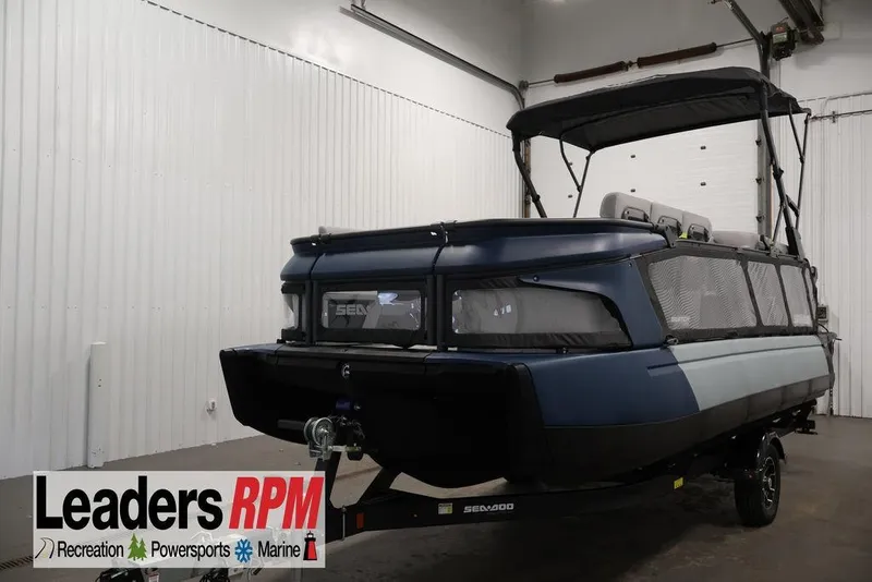 The Image of 2025 Sea-Doo Switch Cruise 21 pontoon boat in indoor showroom setting. - 1