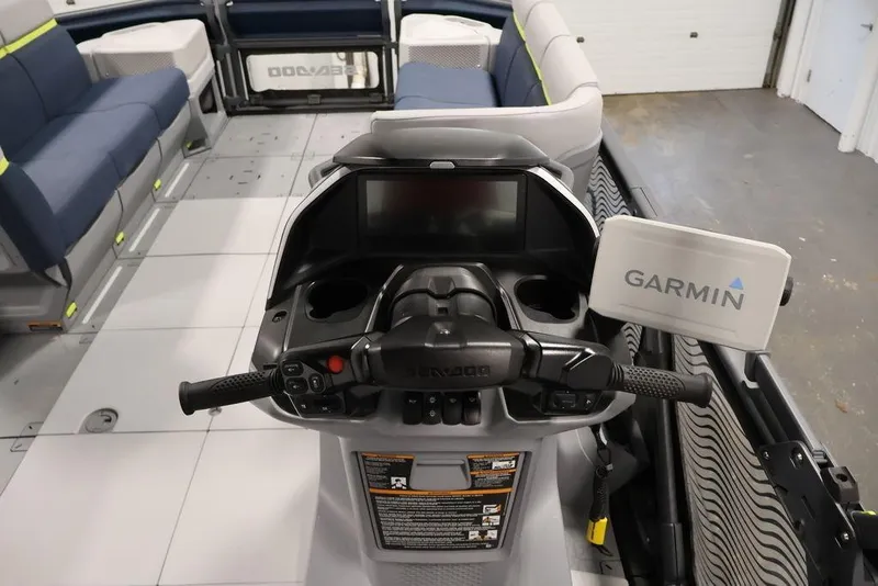 Slide: The Image of 2025 Sea-Doo Switch Cruise 21 dashboard with Garmin navigation system and comfortable seating. - 11
