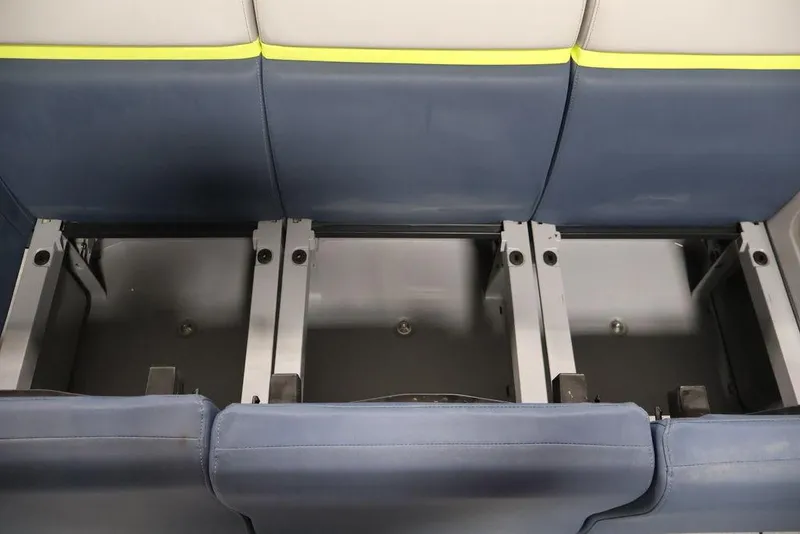 Slide: The Image of 2025 Sea-Doo Switch Cruise 21 seating area with blue and gray upholstery. - 14