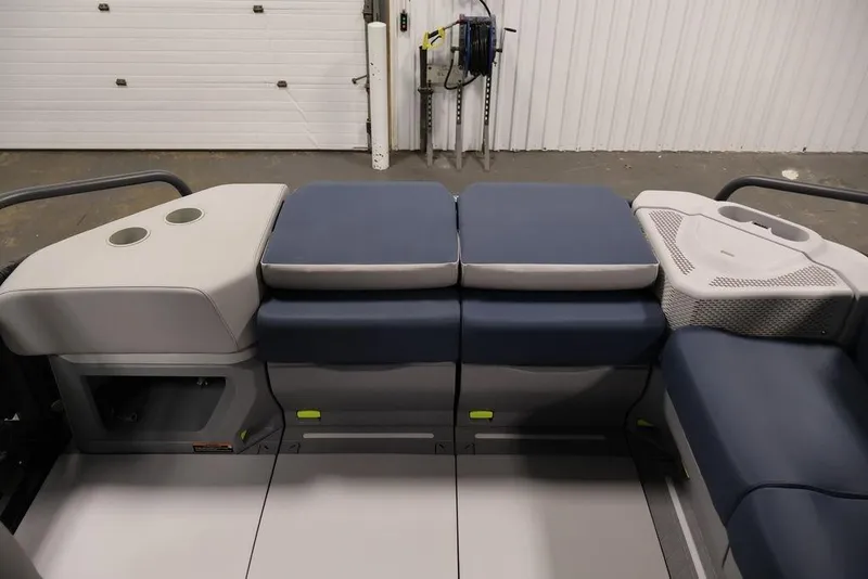 Slide: The Image of 2025 Sea-Doo Switch Cruise 21 interior seating with cup holders and storage compartments. - 23