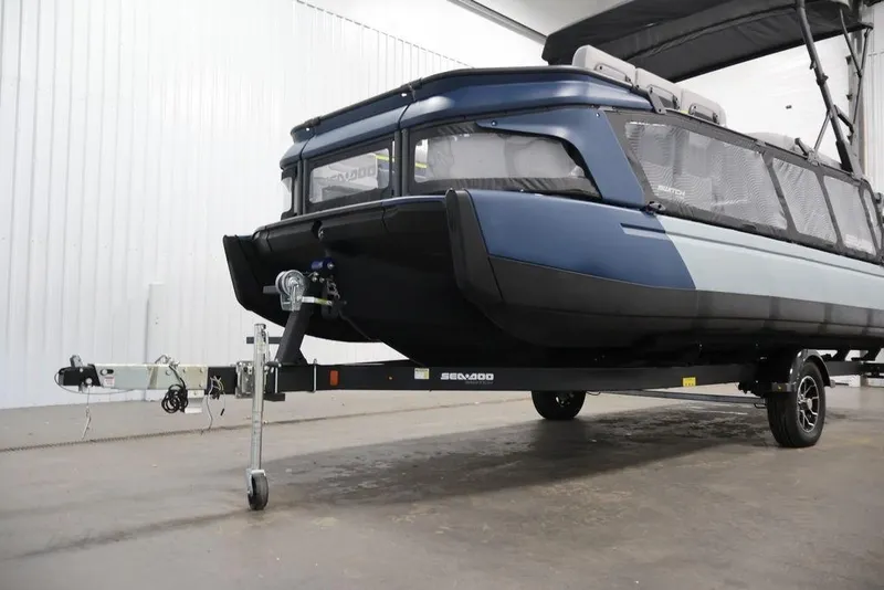 Slide: The Image of 2025 Sea-Doo Switch Cruise 21 on trailer in indoor setting. - 27