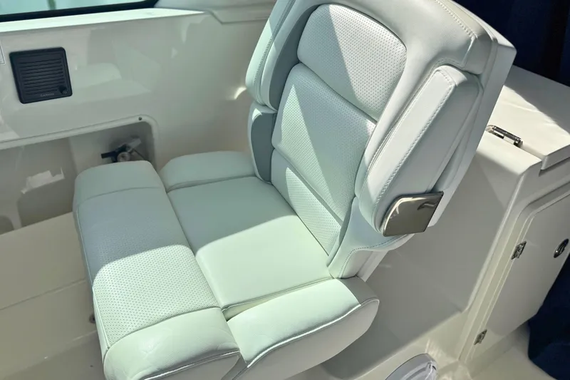 Slide: The Image of Luxurious seating on 2023 Pursuit DC 266 Dual Console boat, featuring premium upholstery. - 21