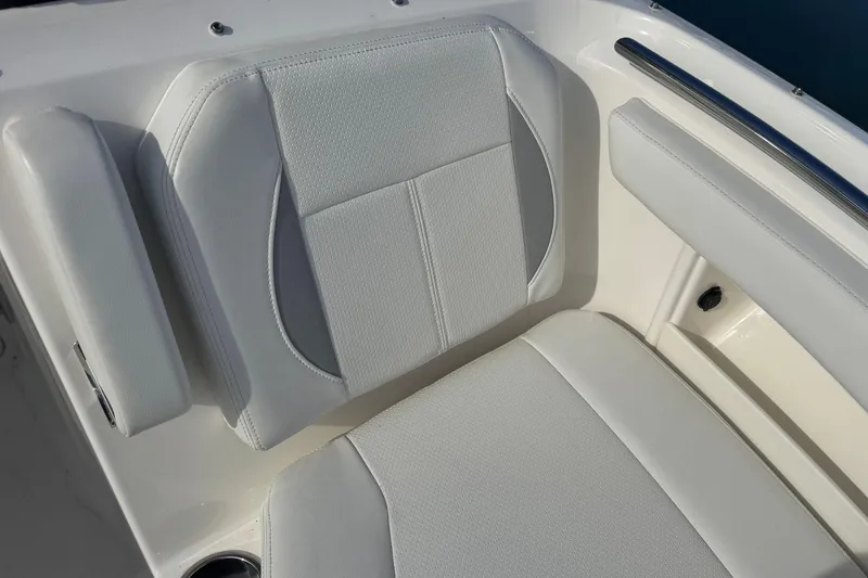 Slide: The Image of 2023 Pursuit DC 266 Dual Console boat seat, featuring sleek white upholstery. - 25