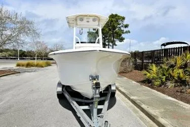 Slide: The Image of 2023 Sea Pro 219 Center Console boat on trailer, parked outdoors. - 11