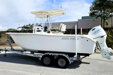 Slide: The Image of 2023 Sea Pro 219 Center Console boat on trailer, featuring Suzuki outboard motor. - 15