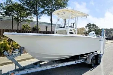 Slide: The Image of 2023 Sea Pro 219 Center Console boat on trailer, parked outdoors. - 18