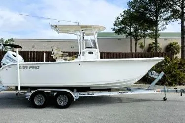 Slide: The Image of 2023 Sea Pro 219 Center Console boat on trailer, parked outdoors. - 7