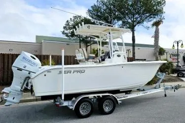 Slide: The Image of 2023 Sea Pro 219 Center Console boat on trailer, parked outdoors. - 8