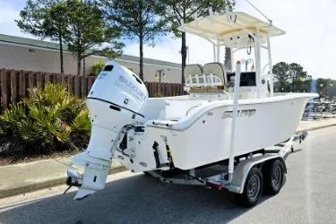 Slide: The Image of 2023 Sea Pro 219 Center Console boat on trailer, parked outdoors. - 9