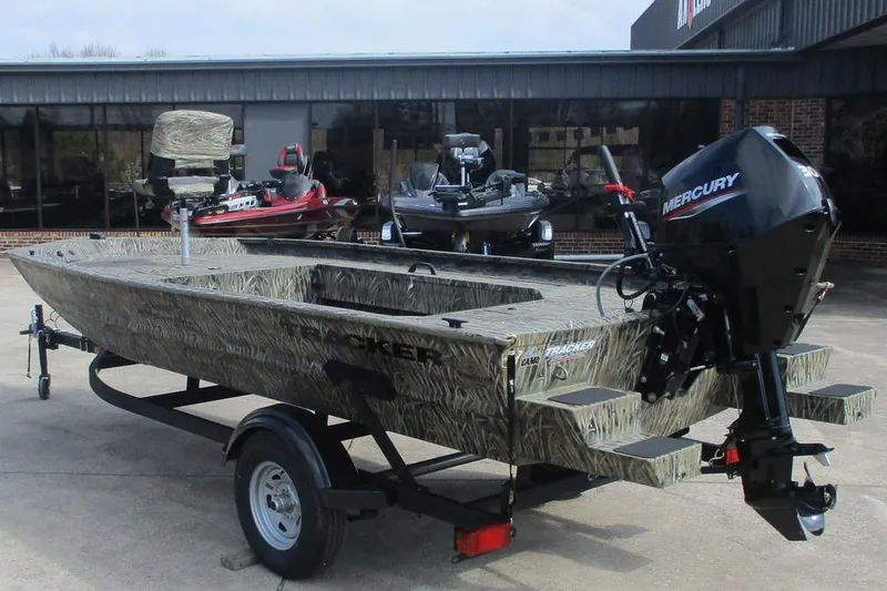 Slide: The Image of 2026 Tracker Grizzly 1654 T Sportsman boat with Mercury engine on trailer. - 5
