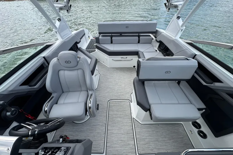 Slide: The Image of 2023 Cobalt R4 boat interior with luxurious seating and modern design on the water. - 13