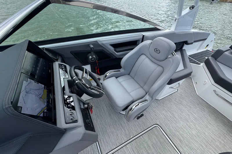 Slide: The Image of 2023 Cobalt R4 boat interior with modern helm and comfortable seating. - 14