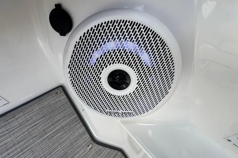 Slide: The Image of 2023 Cobalt R4 boat speaker with blue LED lighting and textured flooring. - 20