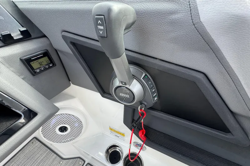 Slide: The Image of 2023 Cobalt R4 boat control panel with throttle and trim buttons. - 24