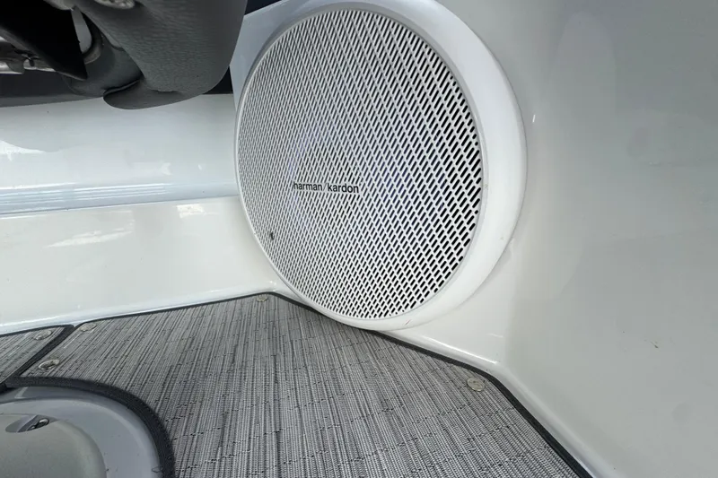 Slide: The Image of Harman Kardon speaker in 2023 Cobalt R4 boat interior, featuring sleek design and textured flooring. - 26