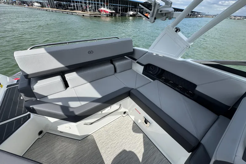Slide: The Image of 2023 Cobalt R4 boat interior with sleek gray seating and waterfront view. - 27