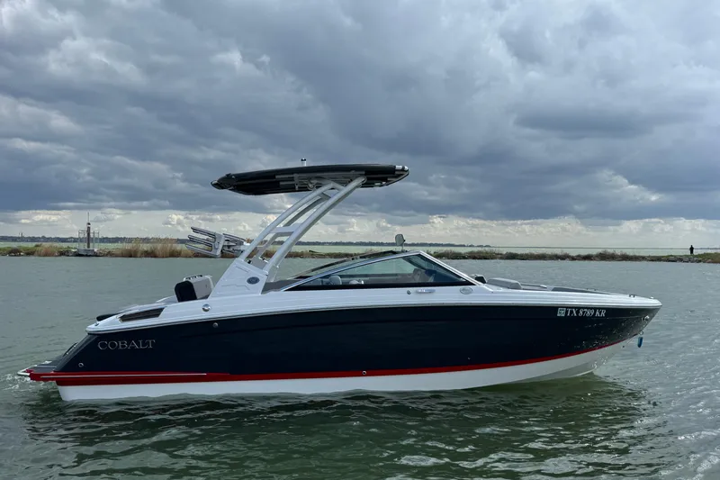Slide: The Image of 2023 Cobalt R4 boat on water under cloudy sky. - 5