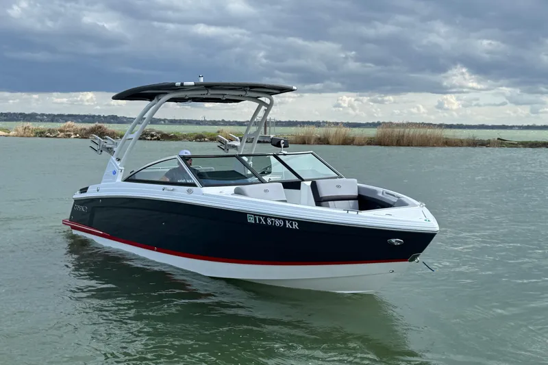 Slide: The Image of 2023 Cobalt R4 boat on water under cloudy sky. - 6