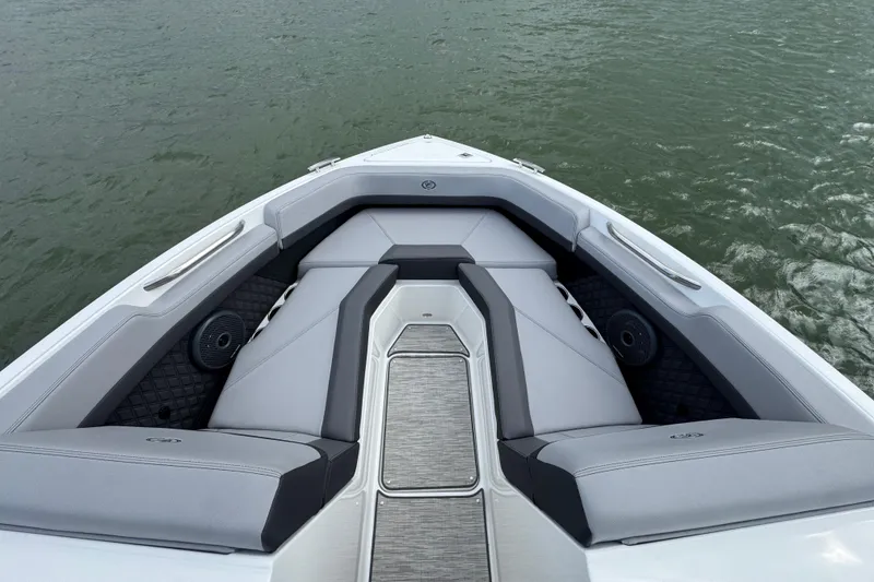 Slide: The Image of 2023 Cobalt R4 boat interior with sleek seating on calm water. - 9