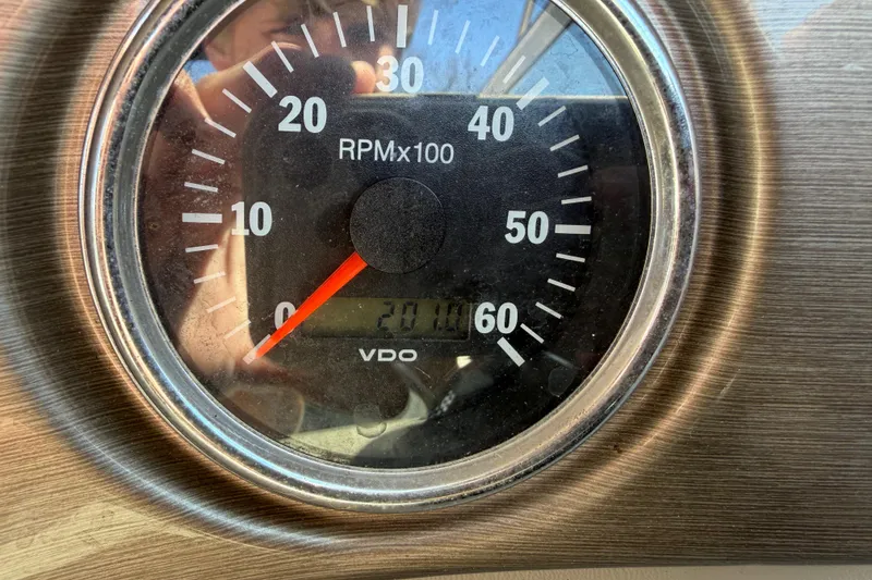 Slide: The Image of Close-up of a 2008 Bryant 268 tachometer showing RPM and hours. - 16