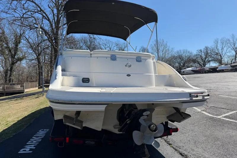 Slide: The Image of 2008 Bryant 268 boat with canopy, parked on asphalt near trees. - 4