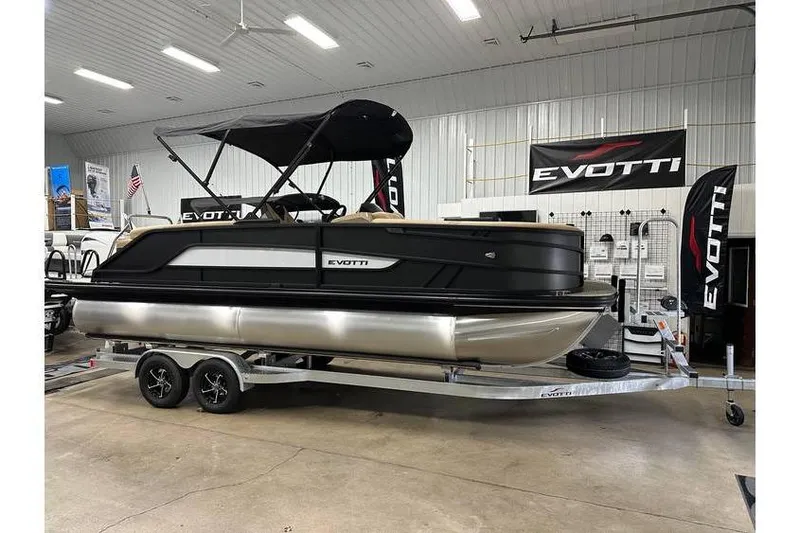 The Image of 2026 Evotti 521QL pontoon boat displayed indoors on a trailer. - 11