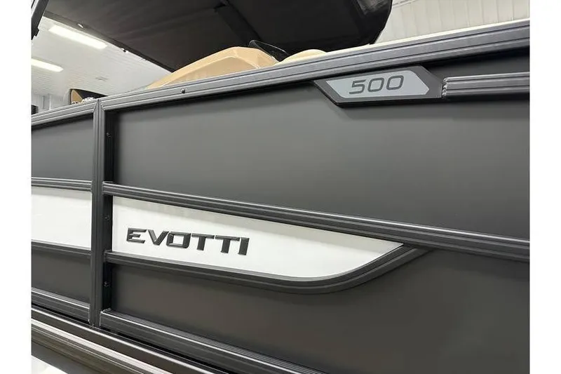 Slide: The Image of 2026 Evotti 521QL boat, sleek black design with "500" emblem. - 12