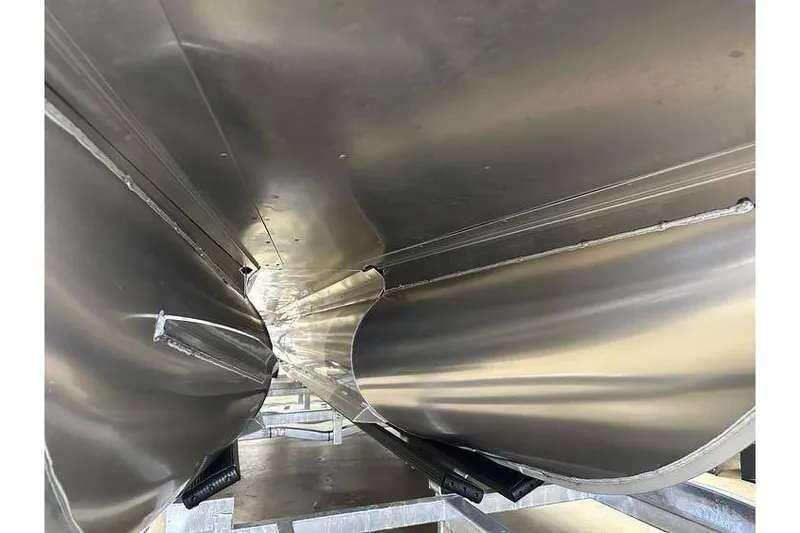 Slide: The Image of Underneath view of 2026 Evotti 521QL boat hull, showcasing sleek metal design. - 14