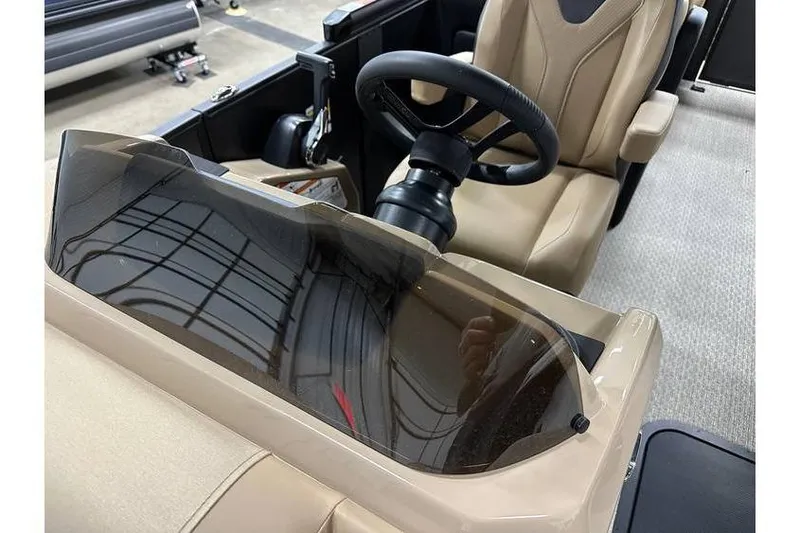 Slide: The Image of Interior of 2026 Evotti 521QL boat with steering wheel and beige seating. - 26