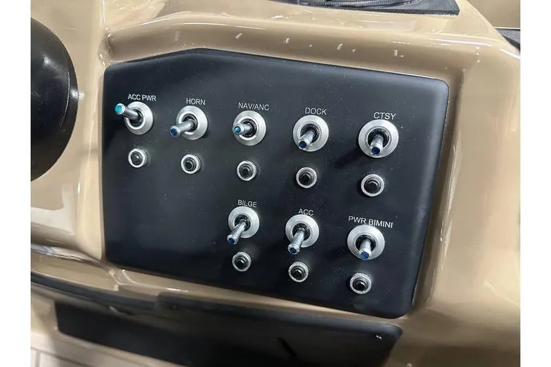 Slide: The Image of Control panel of 2026 Evotti 521QL boat with labeled switches for various functions. - 28
