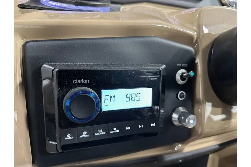Slide: The Image of Car dashboard with Clarion radio displaying FM 98.5, Evotti 521QL 2026 model. - 29