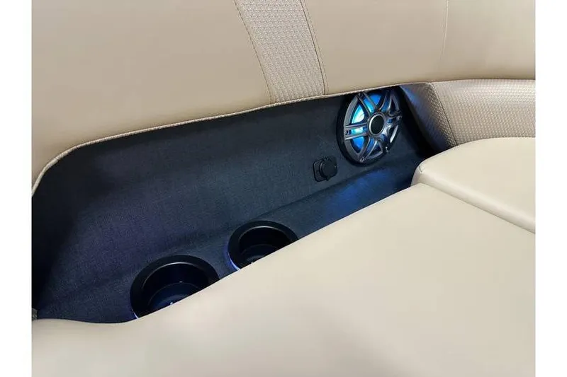 Slide: The Image of Beige interior of 2026 Evotti 521QL with speaker and cup holders. - 30