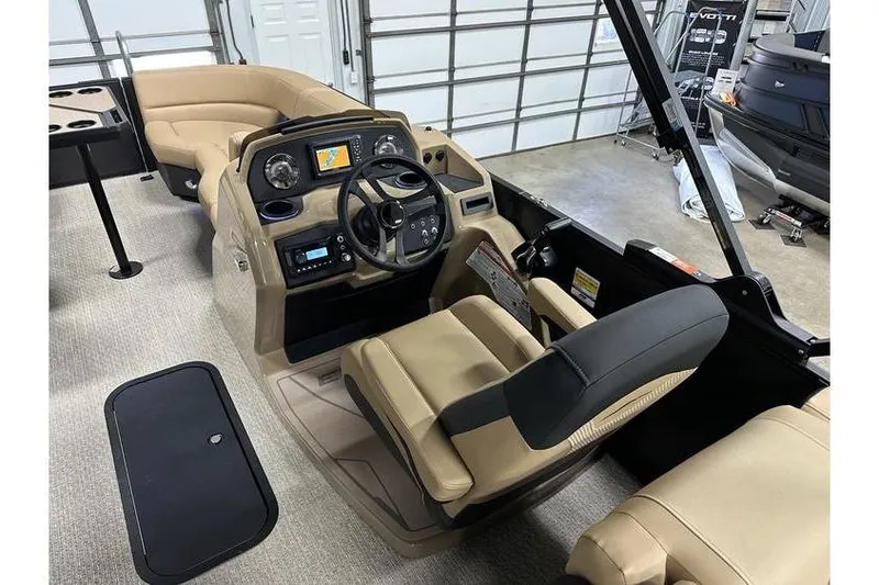 Slide: The Image of Interior of 2026 Evotti 521QL boat with beige seating and modern dashboard controls. - 36