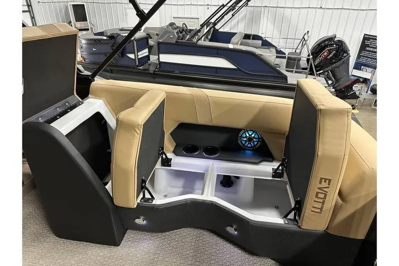 Slide: The Image of Evotti 521QL 2026 boat interior with tan seating and storage compartments. - 39