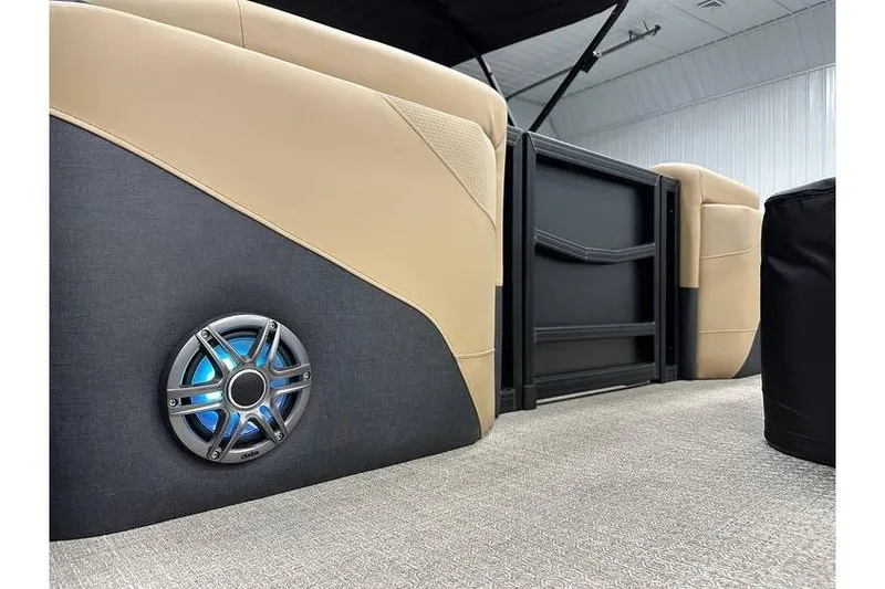 Slide: The Image of Evotti 521QL 2026 boat interior with beige seating and illuminated speaker. - 40