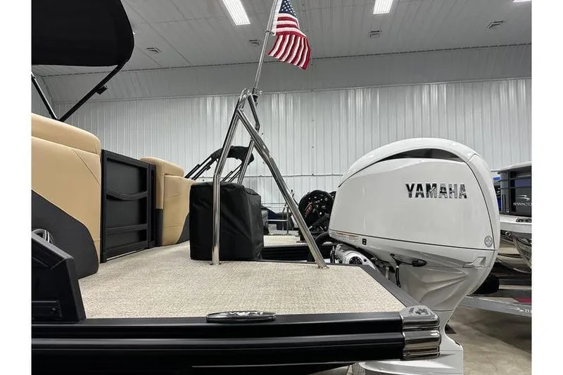 Slide: The Image of Evotti 521QL boat with Yamaha engine and American flag in a showroom, 2026 model. - 41
