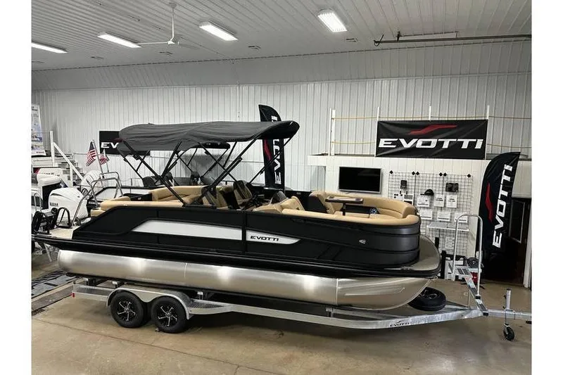 Slide: The Image of 2026 Evotti 521QL pontoon boat displayed indoors on a trailer. - 44