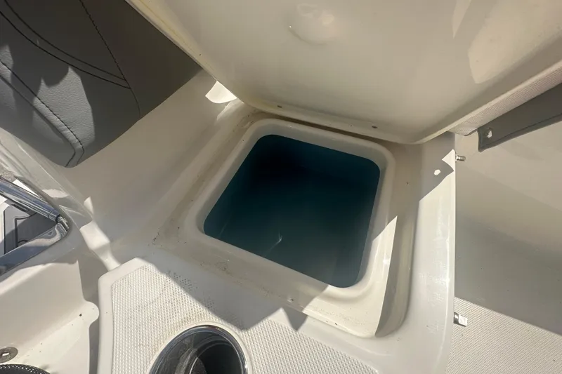 Slide: The Image of Open storage compartment on 2026 Pioneer 180 Sportfish boat, featuring a sleek interior design. - 12