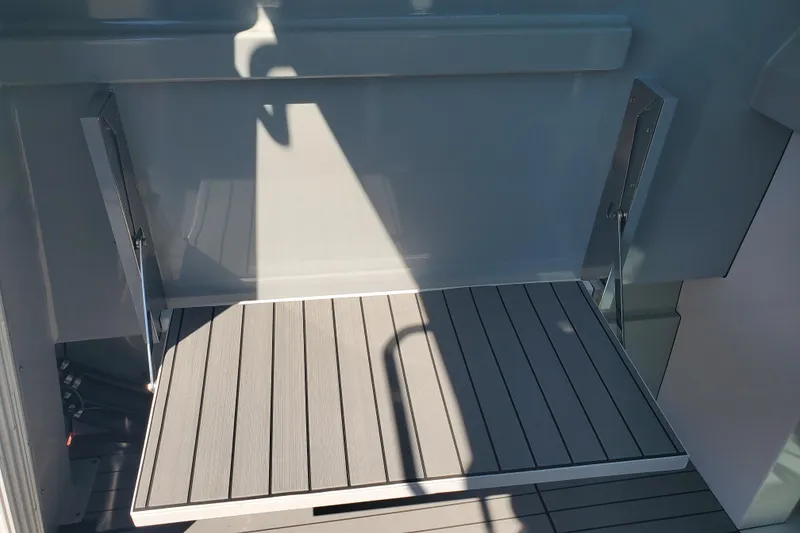 Slide: The Image of 1989 Boston Whaler Challenger boat deck with sleek, modern design and durable materials. - 16